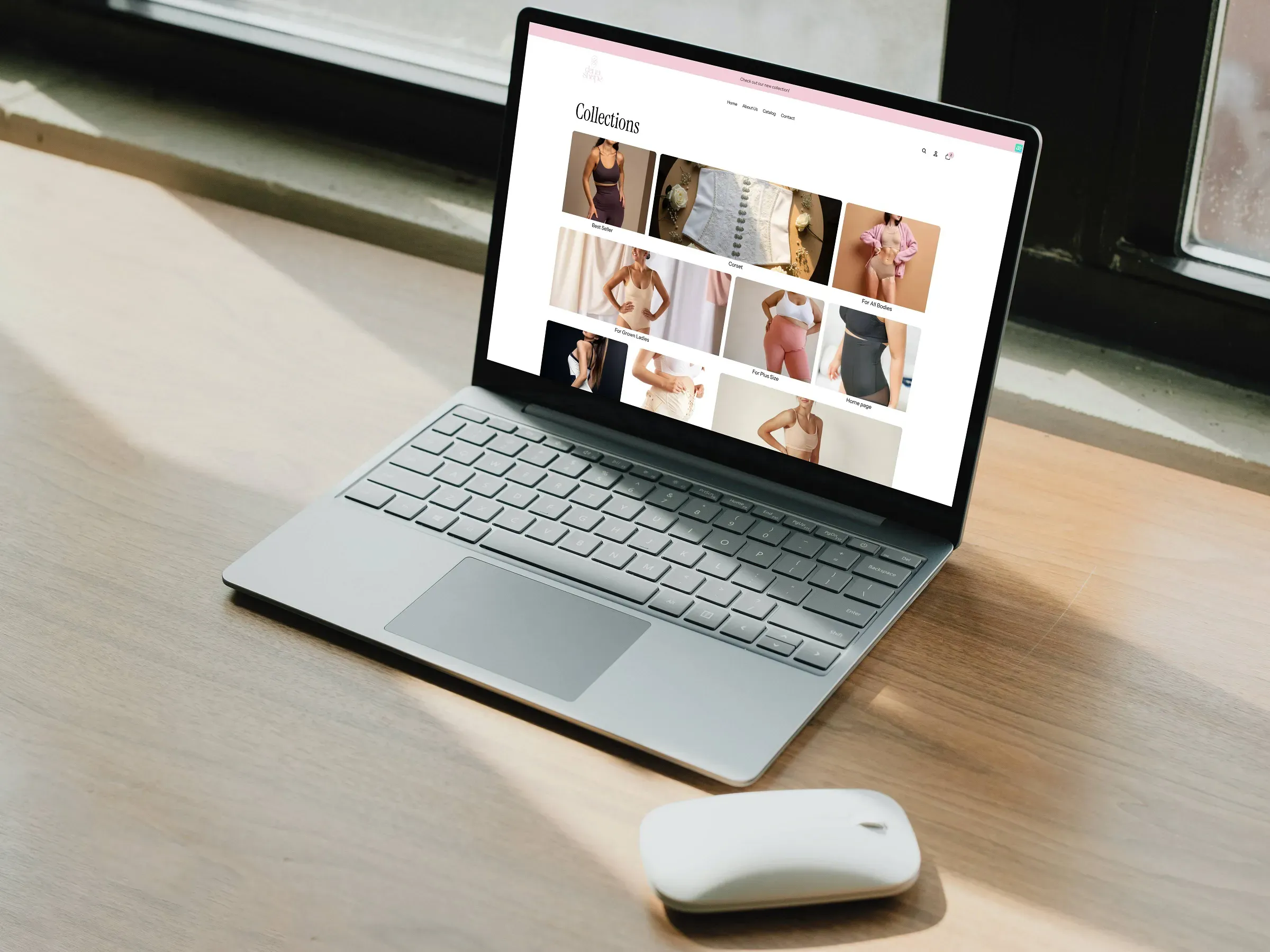 Premium laptop mockup showcasing Shopify website design for Dana Shape shapewear brand